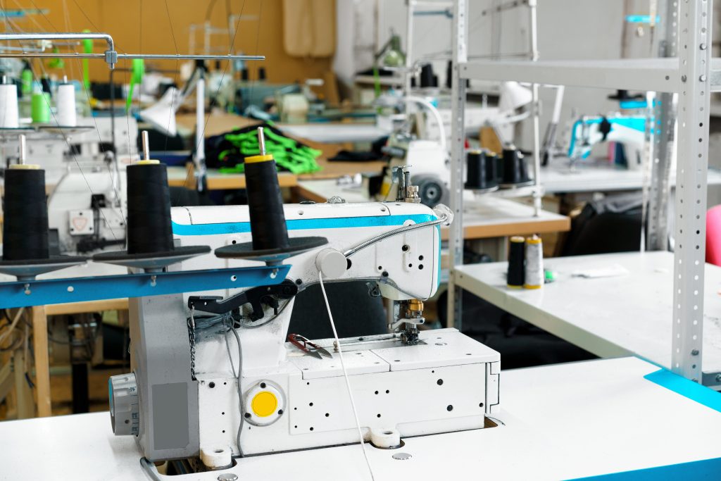 A professional and reliable apparel sourcing agent in Bangladesh inspecting garment quality.