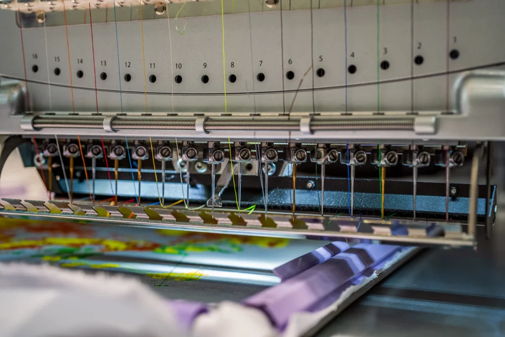Modern wide format digital sublimation printer producing vibrant fabric at Daylight Apparel Ltd.