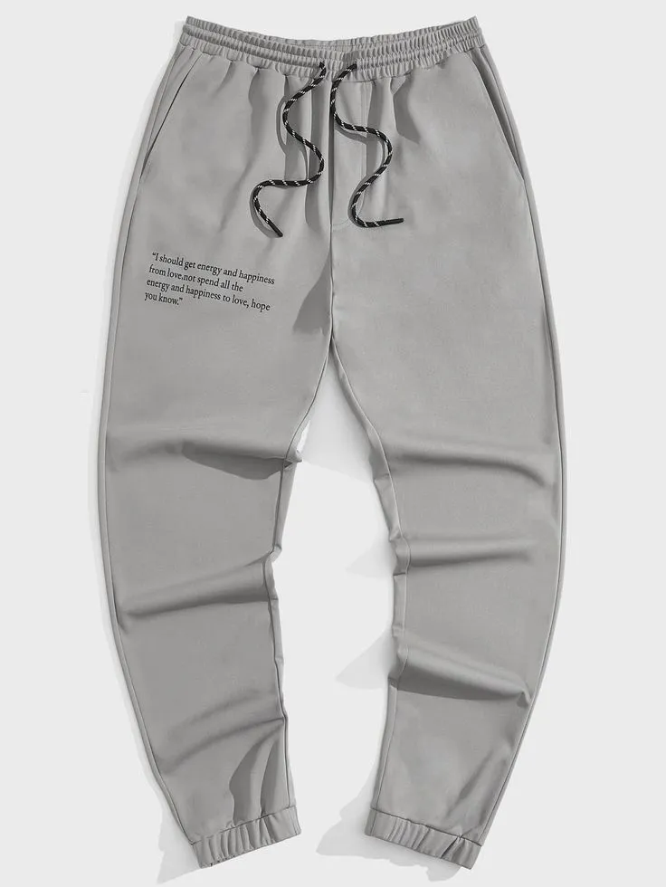 Men Slogan Graphic Drawstring Waist Joggers (1)_5_11zon Contemporary joggers with subtle typography print and a relaxed fit design. Lightweight, comfortable, and ideal for everyday casual wear.